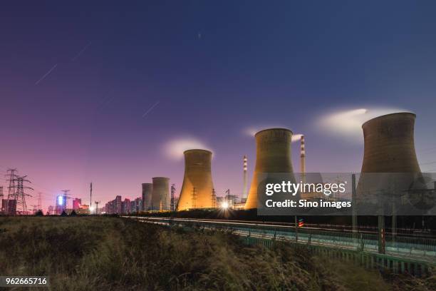 falling stars over coal-fired power plant at night, henan, china - falling stars foto e immagini stock
