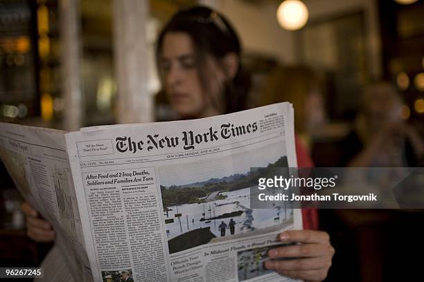 The New York Times being read at Pastis restaurant May, 2008 in New York City.