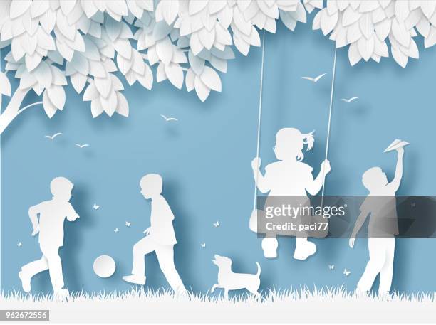 silhouette of happy children playing. paper cut style - child stock illustrations