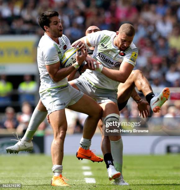 Sean Maitland of Saracens and Nick Isiekwe of Saracens both look to catch the ball during the Aviva Premiership Final between Saracens and Exeter...