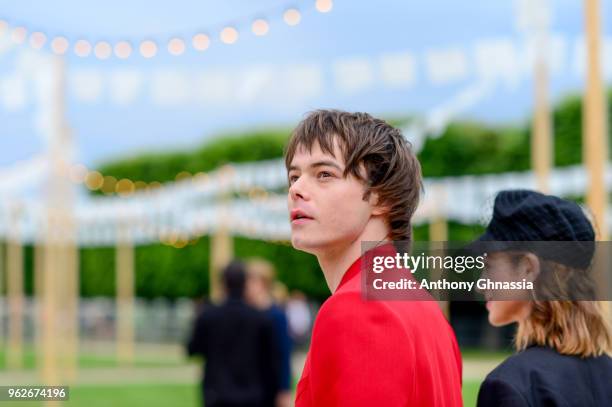 Charlie Heaton and Natalia Dyer attend a photocall during Christian Dior Couture S/S19 Cruise Collection on May 25, 2018 in Chantilly, France.