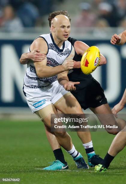 Gary Ablett of the Cats is tackled by Paddy Dow of the Blues during the 2018 AFL round 10 match between the Geelong Cats and the Carlton Blues at...