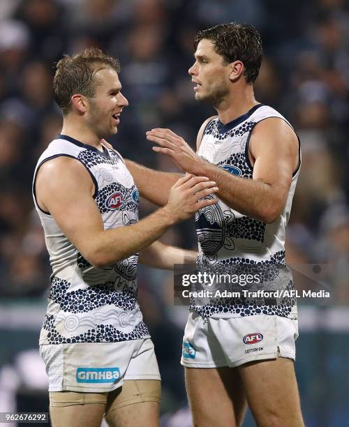 Tom Hawkins of the Cats celebrates a goal with Stewart Crameri of the Cats during the 2018 AFL round 10 match between the Geelong Cats and the...