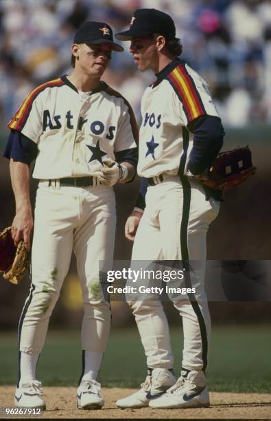 Craig Biggio and Jeff Bagwell of the Houston Astros talk on the field during a 1992 season game.