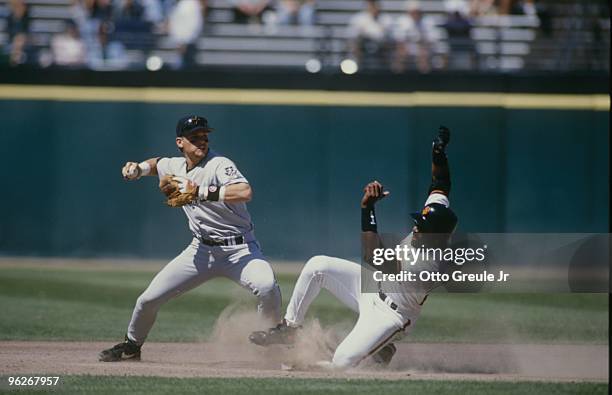 Craig Biggio of the Houston Astros makes a double play as he tags out Barry Bonds of the San Francisco Giants at 3Com Park on June 13,1996 in San...