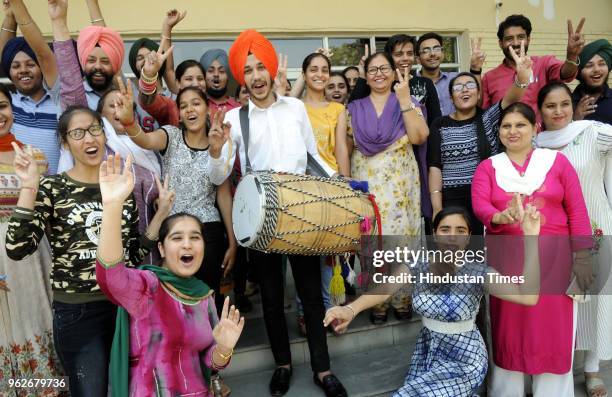 Students in a joyfully mood after the declaration of CBSE class 12 result at Guru Nanak Foundation School, on May 26, 2018 in Patiala, India. A total...