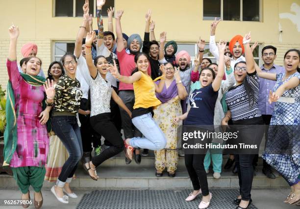 Students in a joyfully mood after the declaration of CBSE class 12 result at Guru Nanak Foundation School, on May 26, 2018 in Patiala, India. A total...