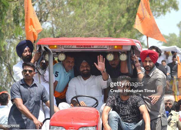 Youth president Bikarm Majithia waving during road show ahead of Shakhkot Bypoll near Lohian Khas, on May 26, 2018 in Jalandhar India. Shiromani...