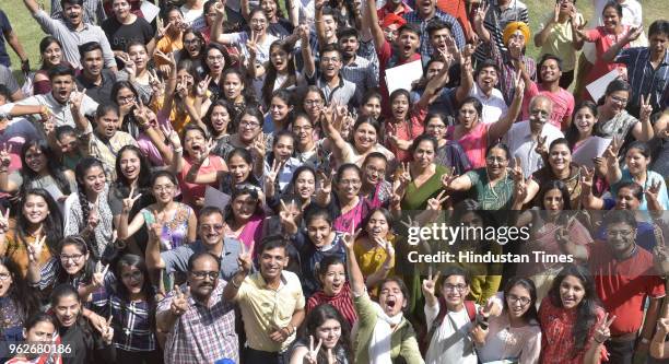 Students of BCM Arya Model School Shastri Nagar in jubilant mood along teachers after CBSE class 12th result declared, on May 26, 2018 in Ludhiana,...