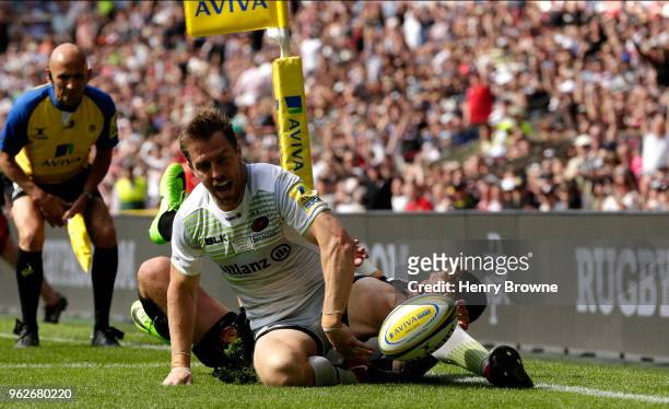 Chris Wyles of Saracens celebrates after scoring his sides third try during the Aviva Premiership Final between Saracens and Exeter Chiefs at...