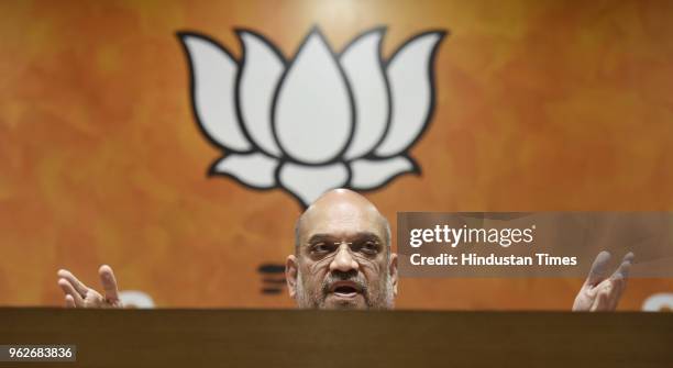 Bharatiya Janata Party President Amit Shah addresses a press conference on four years of NDAs Government, at BJP Headquarters, on May 26, 2018 in New...