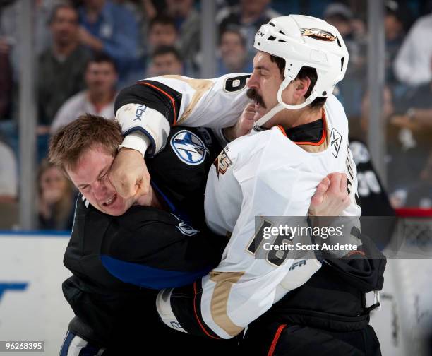 George Parros of the Anaheim Ducks fights with Matt Walker of the Tampa Bay Lightning during the first period at the St. Pete Times Forum on January...