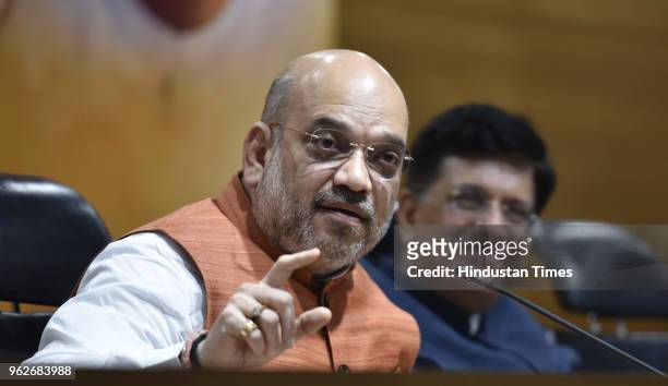 Bharatiya Janata Party President Amit Shah with Railways and coal minister Piyush Goyal address a press conference on four years of NDAs Government,...