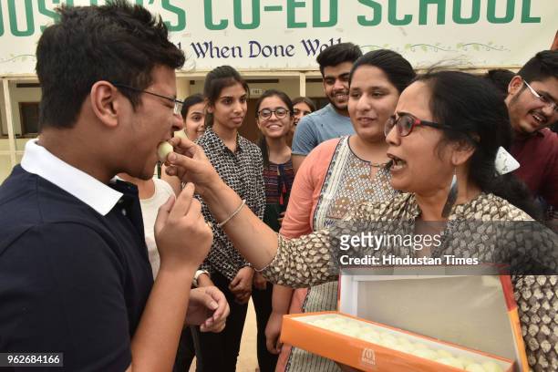 Meritorious students of St Josephs Co-Ed school celebrate their success in CBSE class12th exam results, on May 26, 2018 in Bhopal, India. A total of...