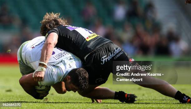 Saracens' Brad Barritt is tackled by Exeter Chiefs' Alec Hepburn during the Aviva Premiership Final between Exeter Chiefs and Saracens at Twickenham...