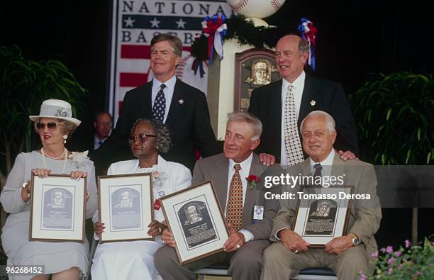 Donald C, Marr, Edward W. Stack, Joanne Fox, Stella Wells, Phil Nickro, Tom Lasorda pose during the 1997 Hall of Fame Induction Ceremony at Clark...