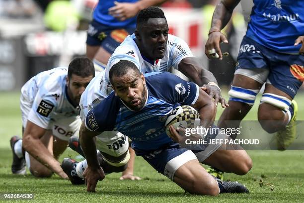 Castres' Australian centre Afusipa Taumoepeau vies with Racing 92's Congolese flanker Yannick Nyanga during the French Top 14 rugby union semi-final...