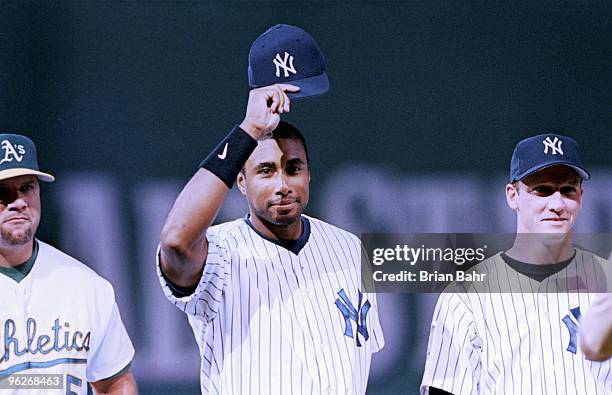 Bernie Williams of the American League waves to fans as he's introduced before the 1999 All -Star Home Game at Fenway Park on July 13,1999 in Boston,...