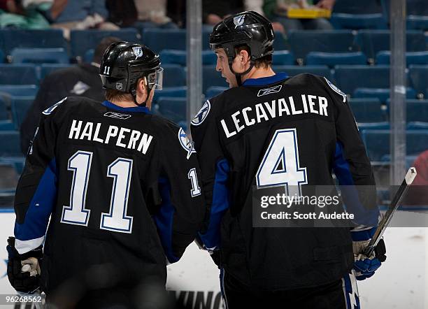 Vincent Lecavalier of the Tampa Bay Lightning talks with teammate Jeff Halpern during a break in the action against the Anaheim Ducks at the St. Pete...