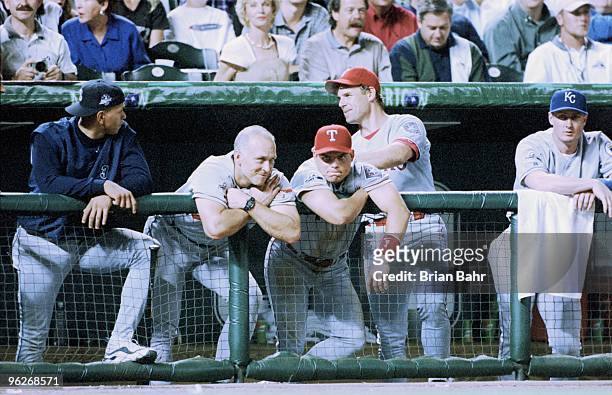 Cal Ripken Jr. #8 and Ivan Rodriguez of the American League look on from the dugout during the MLB All-Star Game at Coors Field on July 7, 1998 in...