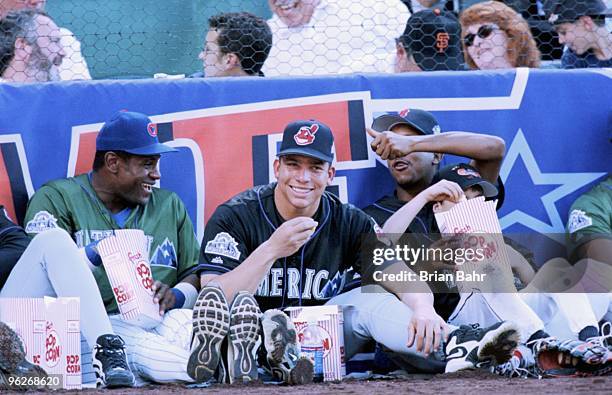 Sammy Sosa of the National League laughs with Bartolo Colon and Pedro Martinez of the American League as they look on during the MLB All-Star Home...