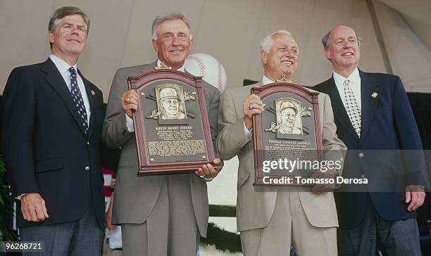 Phil Neikro and Tommy Lasorda are honored during the Hall of Fame Induction Ceremony on August 3, 1997 at the Clark Sports Center in Cooperstown, New...