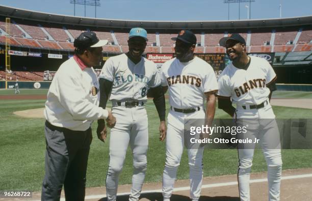 Hall of Famer Willie Mays, Andre Dawson of the Florida Marlins with Bobby Bonds and Barry Bonds of the San Francisco Giants pose before the game at...