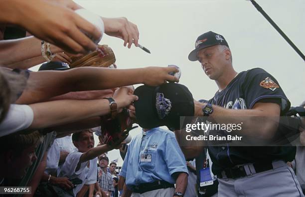 Cal Ripken Jr. Signs autographs prior to the 69th MLB All-Star Game at Coors Field on July 7, 1998 in Denver, Colorado.