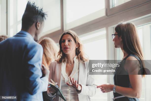 business people standing in the office - government relations stock pictures, royalty-free photos & images