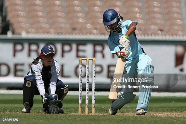 Lisa Sthalekar of the Breakers hits down the ground during the WNCL Final match between the NSW Breakers and the DEC Victoria Spirit held at the...