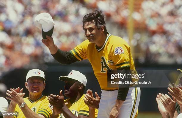 Retired pitcher Rollie Fingers of the Oakland Athletics waves after being introduced before the Old Timers game in the 1991 season at Oakland-Alameda...