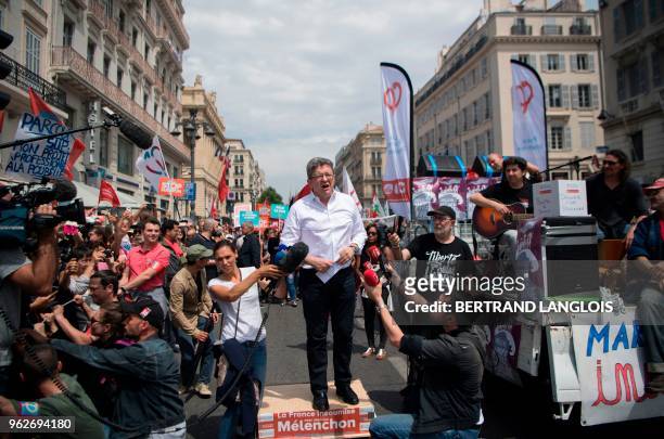 French member of Parliament and leader of the far-left La France Insoumise party Jean-Luc Melenchon delivers a speech as he arrives to take part in a...