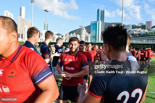 Players of Hong Kong greet to Malaysia's players after defeating them during the Hong Kong vs Malaysia Asia Rugby Championship and Rugby World Cup...