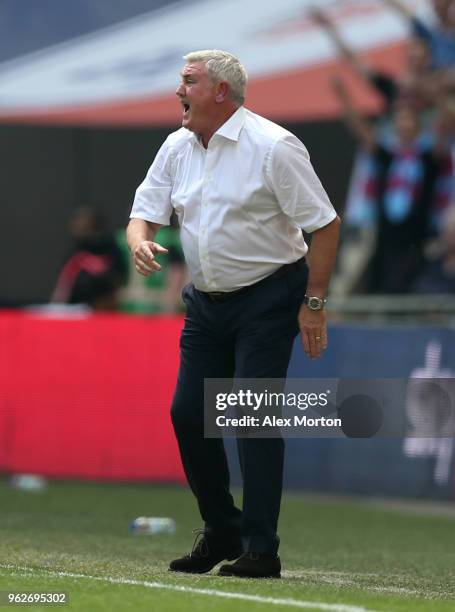 Steve Bruce, Manager of Aston Villa gives his team instructions during the Sky Bet Championship Play Off Final between Aston Villa and Fulham at...