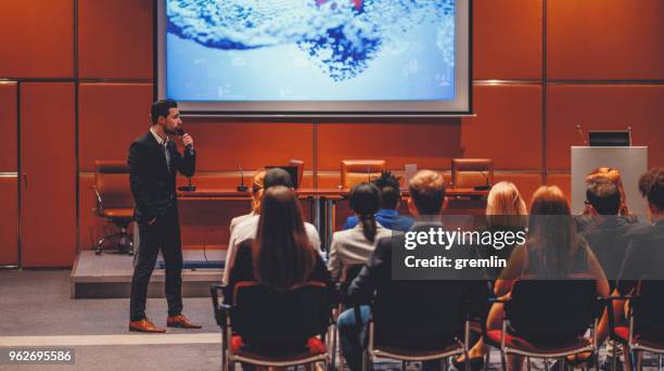 public speaker at science convention - auditorium presentation stock pictures, royalty-free photos & images