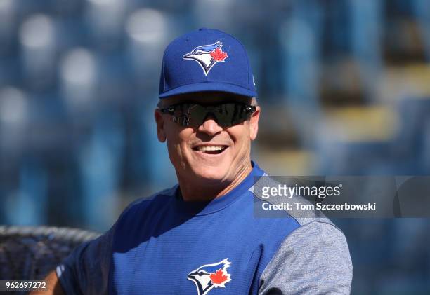 Manager John Gibbons of the Toronto Blue Jays looks on during batting practice before the start of MLB game action against the Los Angeles Angels of...