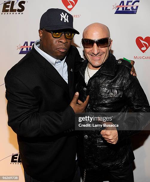 Musician Vince Wilburn Jr. And drummer Kenny Aronoff arrive at the 2010 MusiCares Person Of The Year Tribute To Neil Young at the Los Angeles...