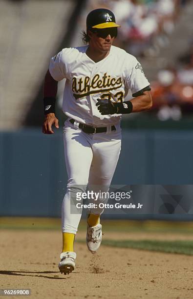 Jose Canseco of the Oakland Athletics runs the bases during the game against the California Angels at Oakland-Alameda County Coliseum on August 15,...