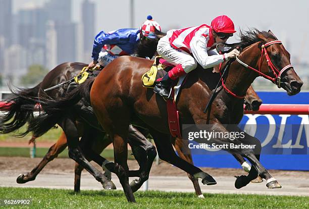 Jockey Craig Williams riding Tollesprit wins the Schweppes 1200 during the Coolmore Lightning Stakes Day meeting at Flemington Racecourse on January...