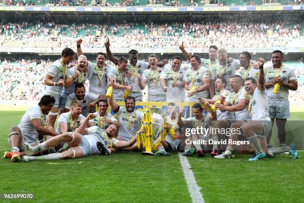 The Saracens team celebrate with the Aviva Premiership trophy after the Aviva Premiership Final between Saracens and Exeter Chiefs at Twickenham...