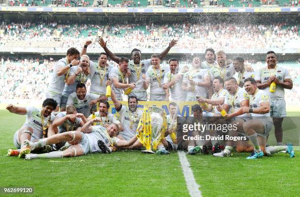 The Saracens team celebrate with the Aviva Premiership trophy after the Aviva Premiership Final between Saracens and Exeter Chiefs at Twickenham...
