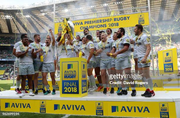 Brad Barritt of Saracens lifts the Aviva Premiership trophy following his side's victory during the Aviva Premiership Final between Saracens and...