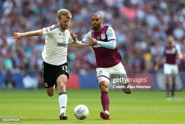 Tim Ream of Fulham is challenged by Lewis Grabban of Aston Villa during the Sky Bet Championship Play Off Final between Aston Villa and Fulham at...