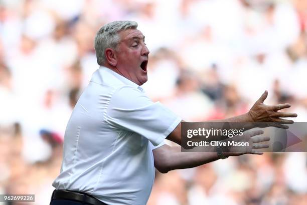 Steve Bruce, Manager of Aston Villa gives his team instructions during the Sky Bet Championship Play Off Final between Aston Villa and Fulham at...