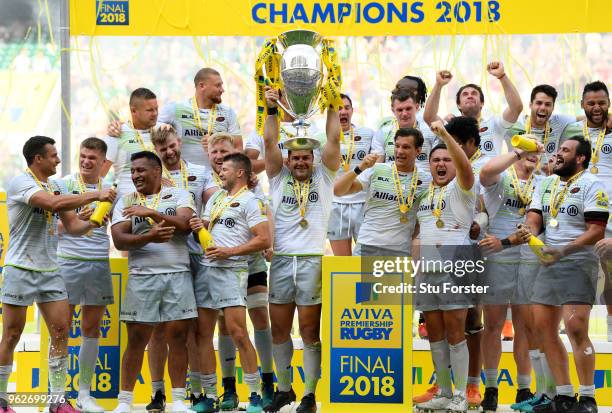 Brad Barritt of Saracens lifts the Aviva Premiership trophy following his side's victory during the Aviva Premiership Final between Saracens and...