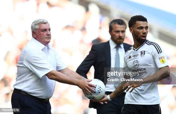 Steve Bruce, Manager of Aston Villa gives the ball to Ryan Fredericks of Fulham during the Sky Bet Championship Play Off Final between Aston Villa...