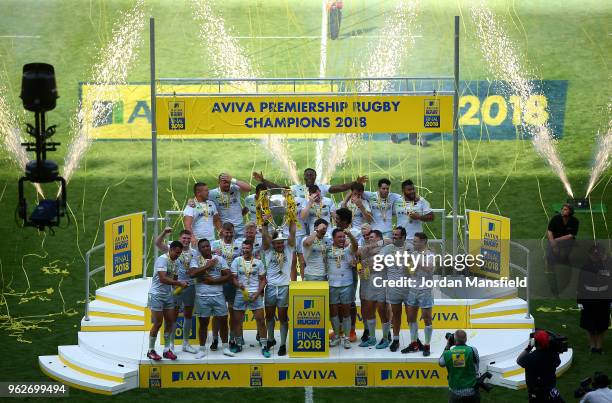 Brad Barritt of Saracens lifts the Aviva Premiership trophy following his side's victory during the Aviva Premiership Final between Saracens and...