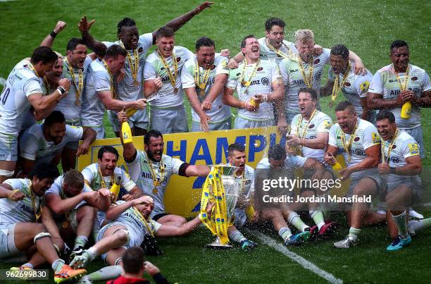 The Saracens team celebrate victory with the Aviva Premiership trophy following the Aviva Premiership Final between Saracens and Exeter Chiefs at...