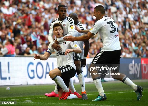 Tom Cairney of Fulham celebrates after scoring his sides first goal with his team mates during the Sky Bet Championship Play Off Final between Aston...