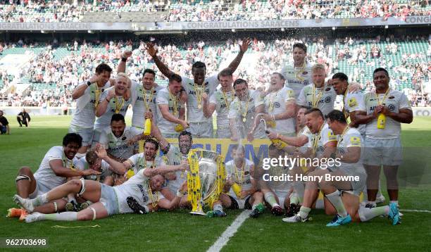 Saracens players and staff celebrate with the Aviva Premiership Trophy following their victory in the Aviva Premiership Final between Saracens and...